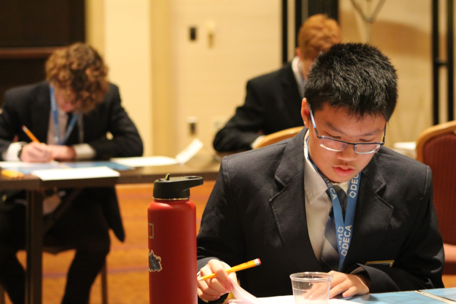 Octavian Yuen completes his written test at the DECA conference in Orlando, FL.