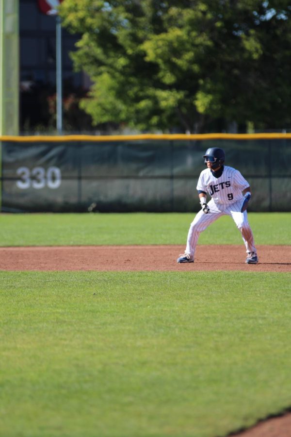 Freshman Evan Furuichi leads of second base during the 2023 WACC Championship game at College of Alameda.