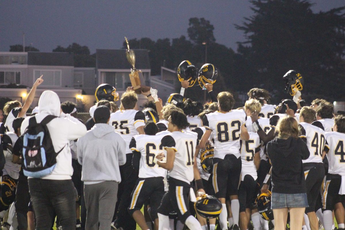 Alameda celebrates with the Alameda Chamber of Commerce Perpetual Trophy.
