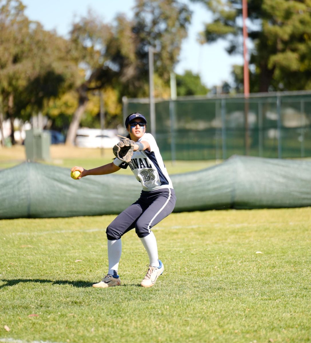 Sophomore Cam Tran makes a throw from the outfield during a 14-4 win over San Leandro.