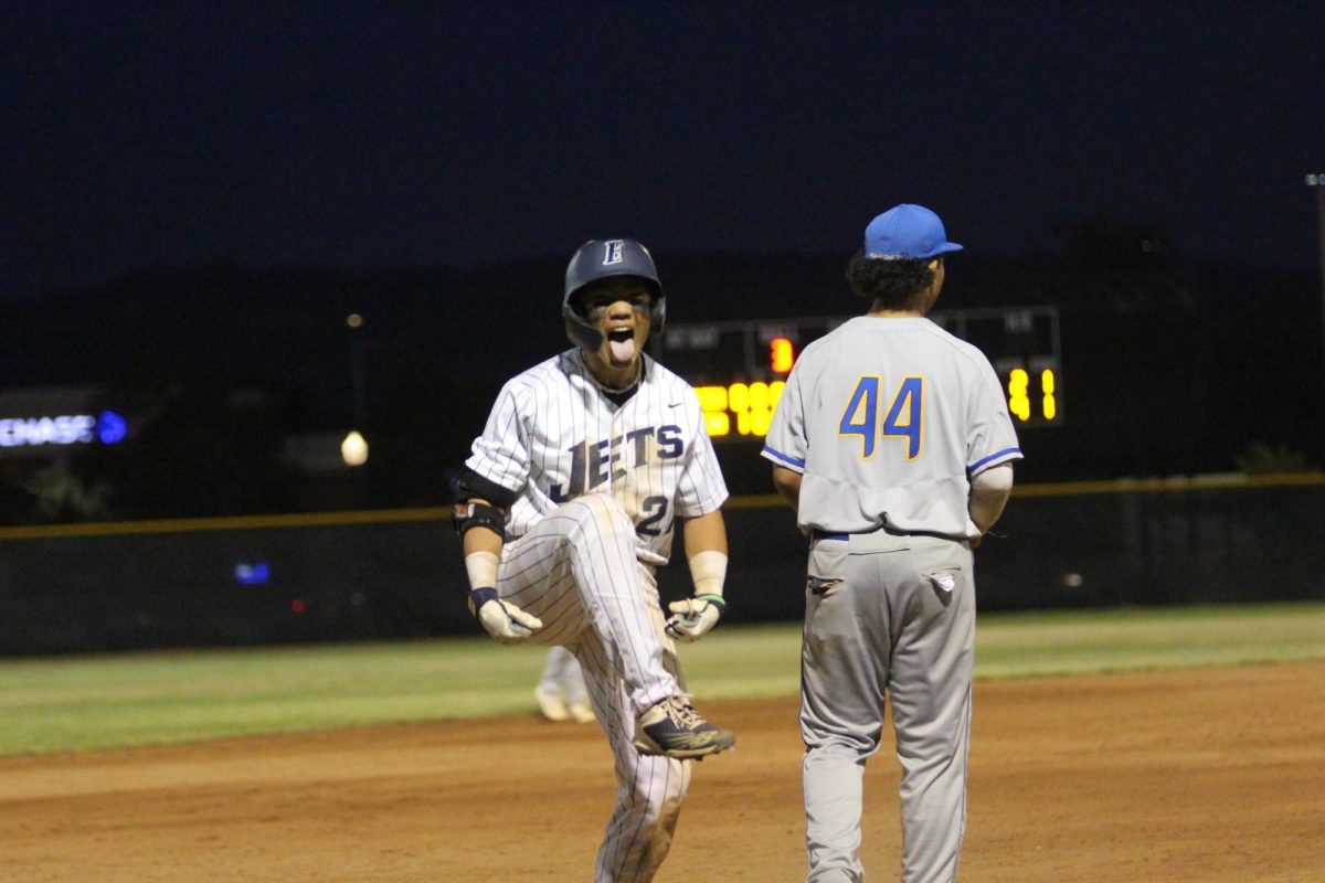 League MVP Evan Furuichi celebrates a huge triple; giving the Jets a 5-1 lead.