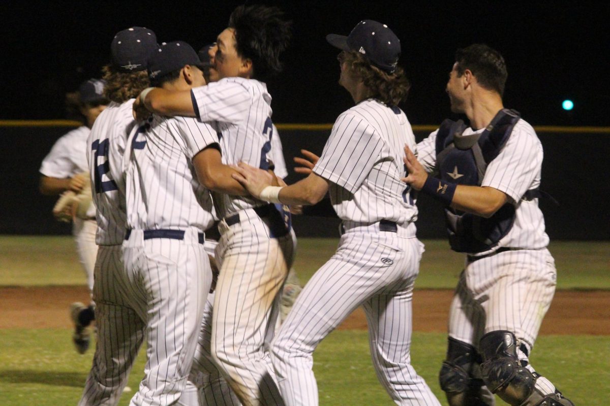 The Jets celebrate winning the second straight WACC Shoreline League Championship on May 9.