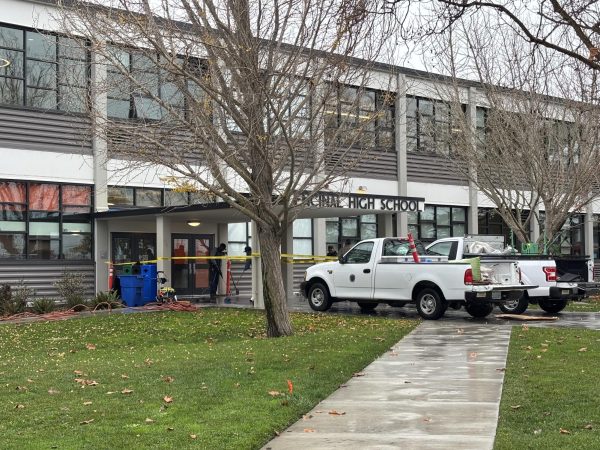 AUSD maintenance staff clean up vandalism in front of Encinal's entrance on December 13, 2024.