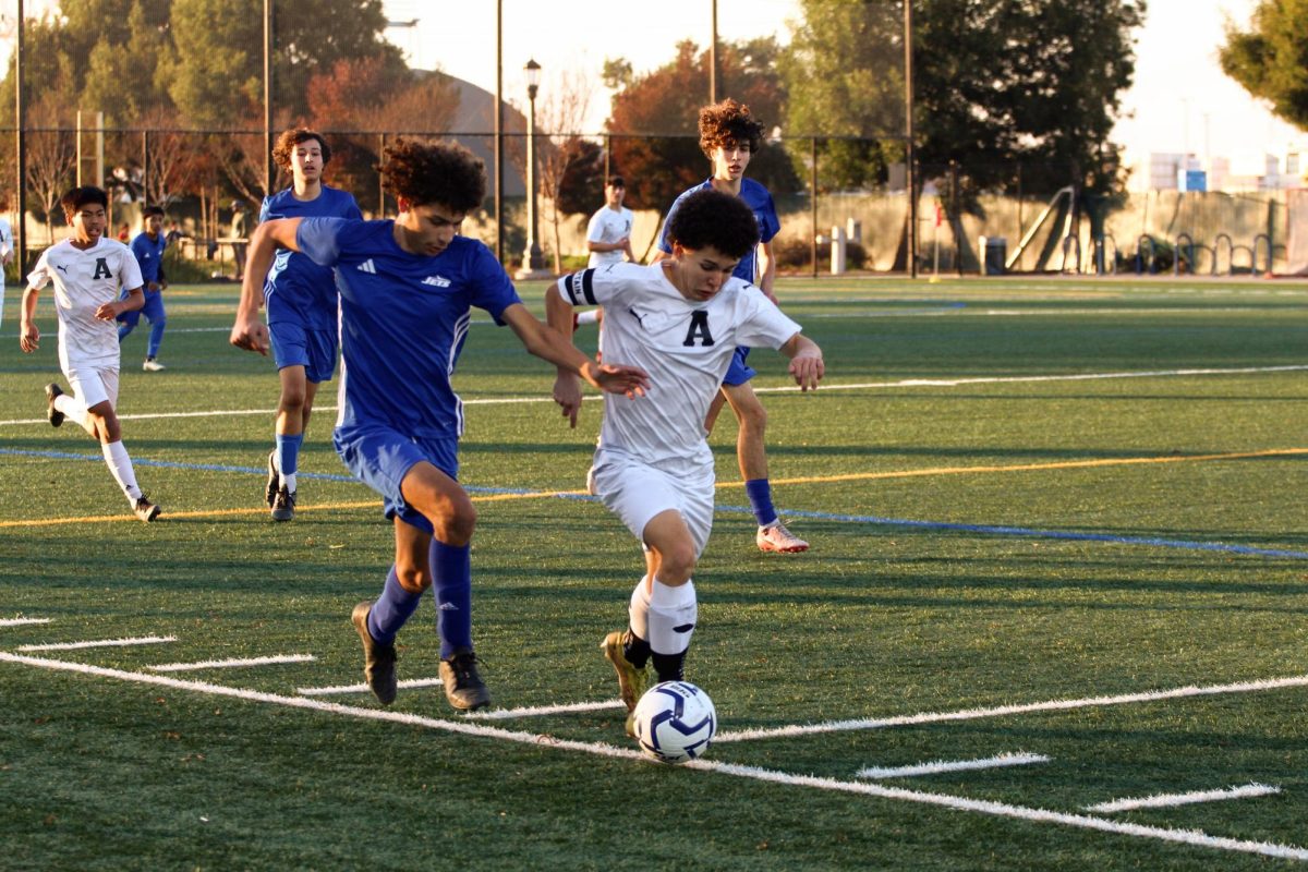 Freshman center back Victor Johnson attempts to recover after getting beat by Hornet's pacey winger Mateus Penner.