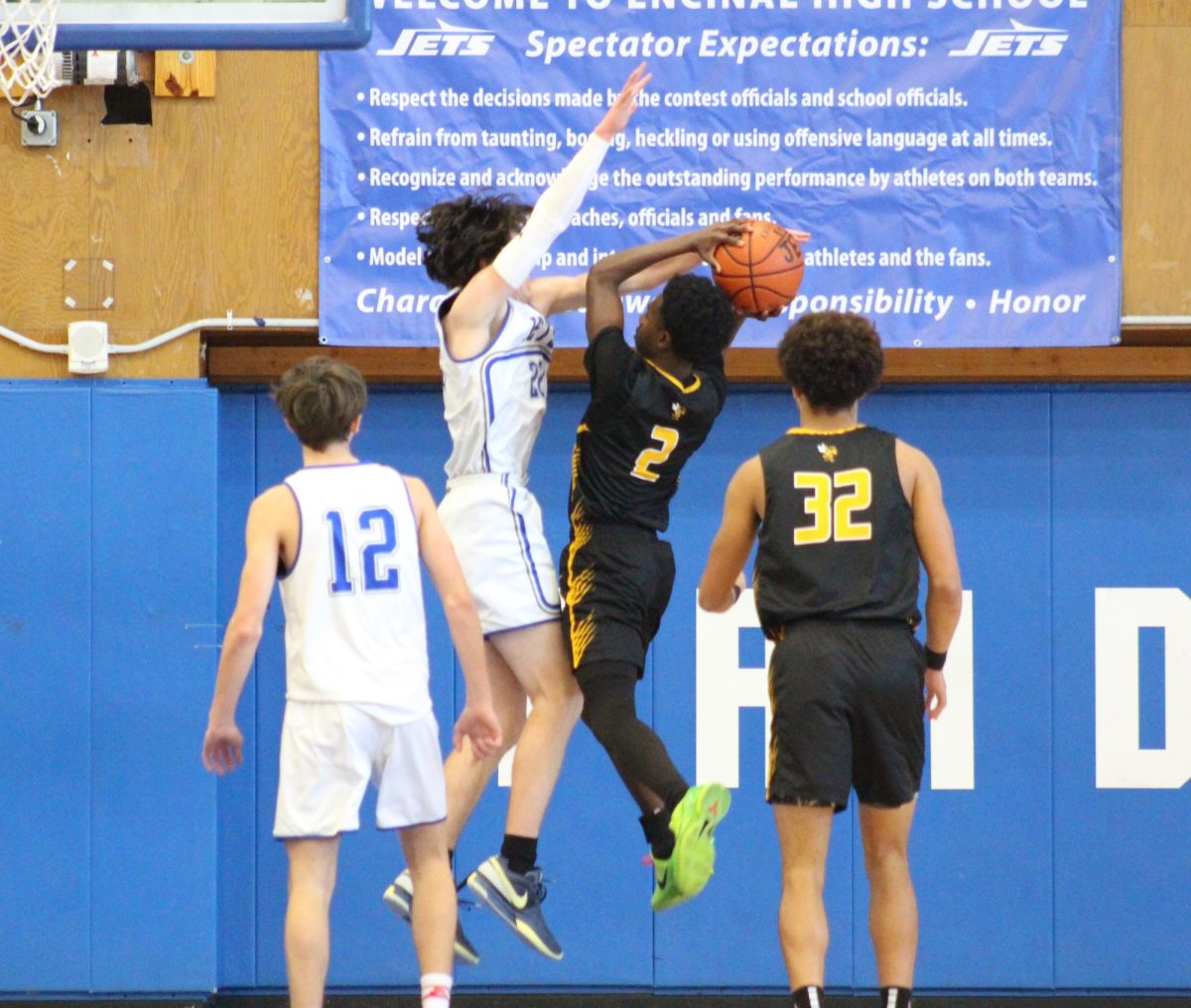 Sophomore center, Orion Juhas, protecting the paint by contesting #2 on Alameda High on January 11th.
