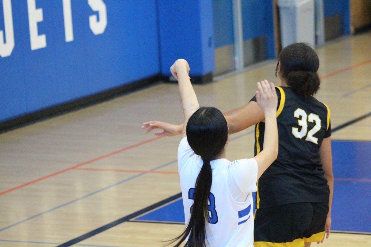 ASTI Varsity guard Haley Huynh (12) forces Alameda High to time out after scoring back to back three’s during the Island Slam at Encinal on January 11th. 