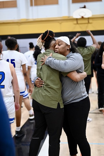 Encinal coach Juanita Lyons congratulations Head Royce's coach after the Jayhawks' 53-48 victory.