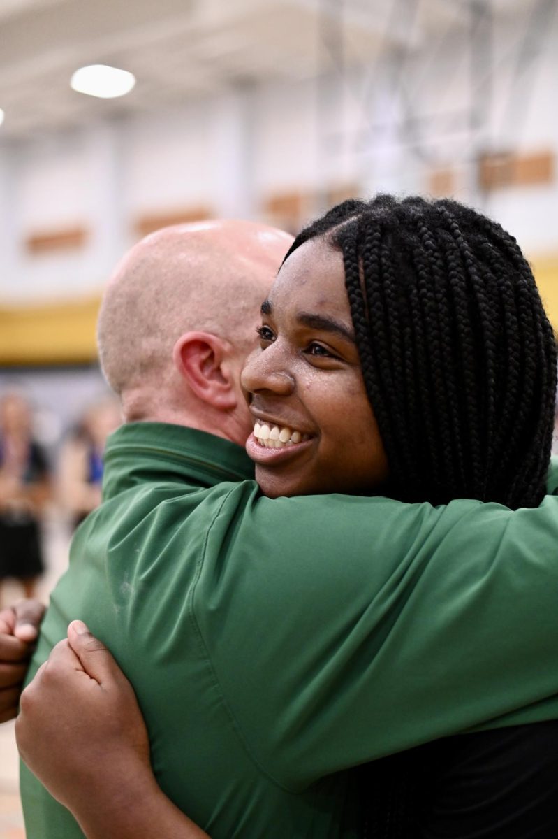 Head Royce's Senior captain Morgan Ross hugs her coach after winning the NCS Championship on March 1. Ross was named MVP of the tournament.