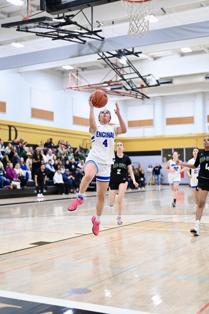 Senior Surina Castro drives the ball down court during the 4th quarter to bring the Jets within 2 points of Head Royce.